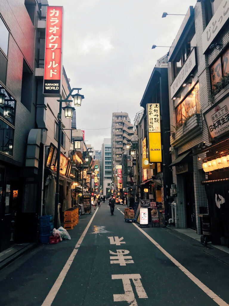 Vibrant Tokyo Street Scene: Neon Lights & Urban Life Wallpaper
