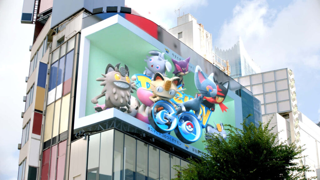 Vibrant Tokyo Street Wallpaper with Pokémon Go Billboard