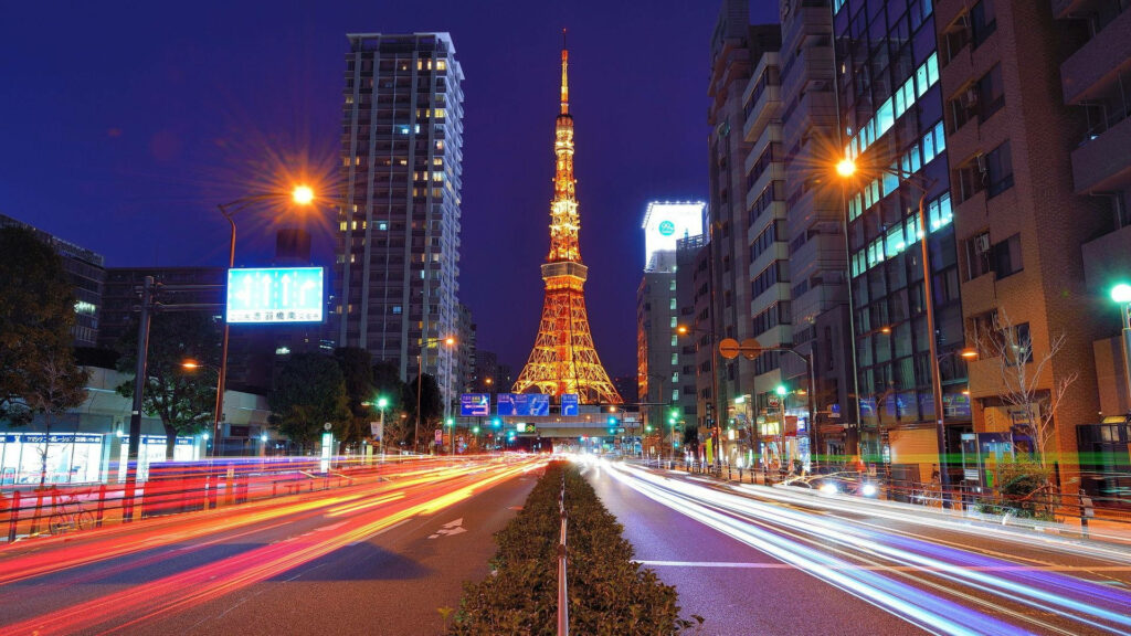 Glowing Tokyo Tower Night Wallpaper: Vibrant Urban Scene