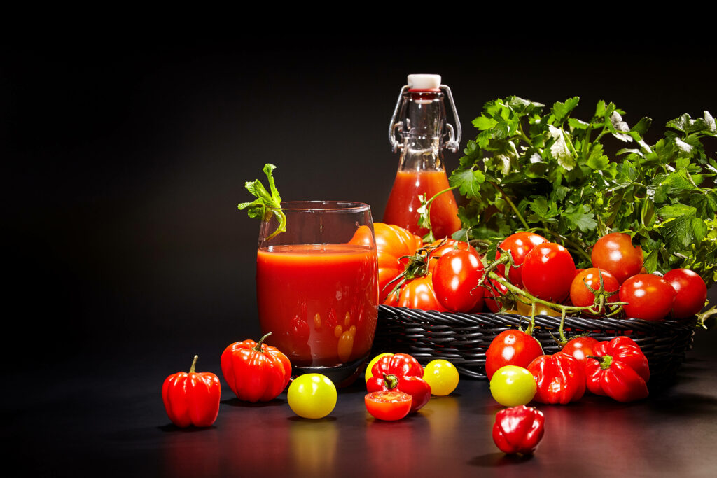 Vibrant Tomato & Fruit Wallpaper with Fresh Herbs on Dark Background