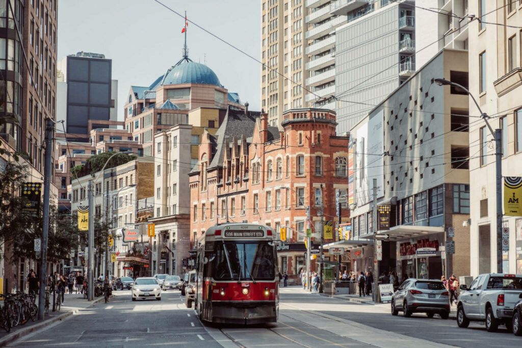 Vibrant Toronto Streetcar Wallpaper: Historic Meets Modern Urban Life