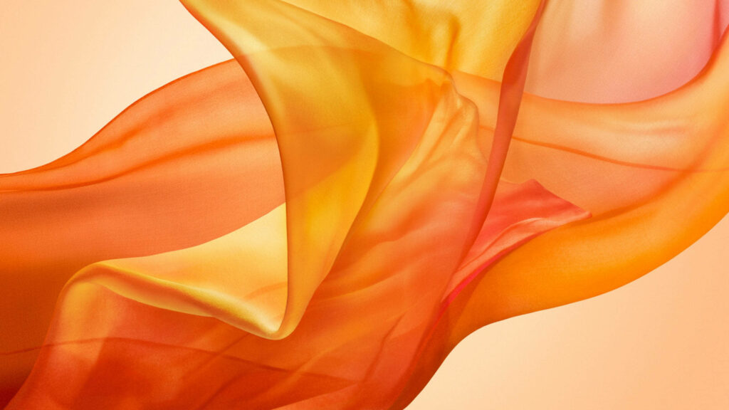 Fabric Bolt Shrouds Orange Macbook Air in Mystical Wallpaper