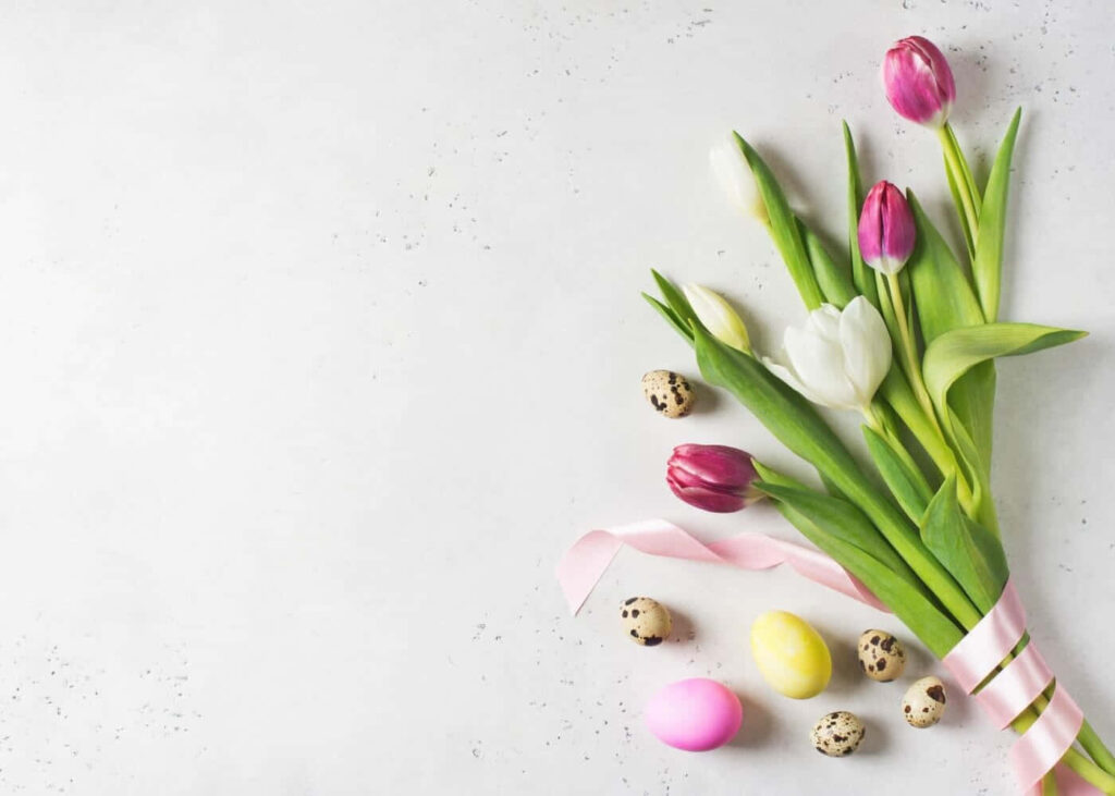 Springtime Tulips & Pastel Eggs on Soft White Background Wallpaper