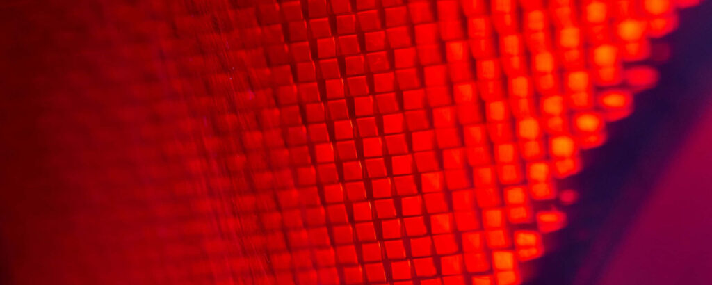 Vibrant Ultra-Wide HD Wallpaper: Macro Red Illuminated Squares Design