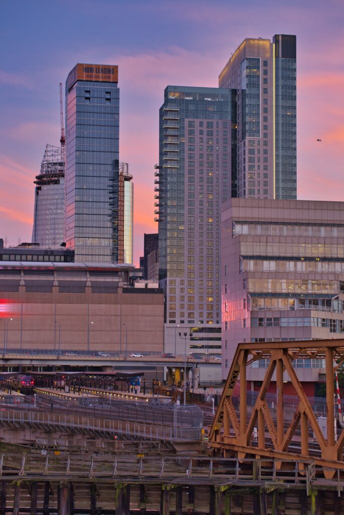 Vibrant Urban Cityscape Wallpaper: Modern Skyscrapers & Sunset Sky