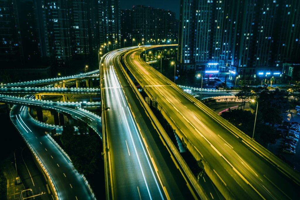 Stunning Urban Nightscape Wallpaper with Vibrant Light Trails