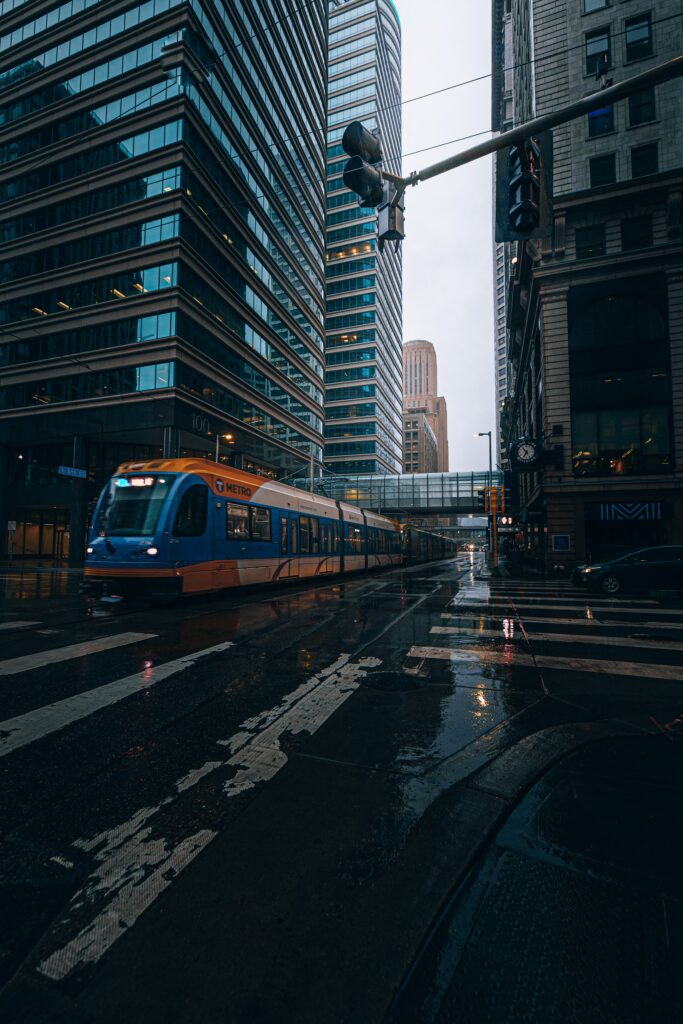 Vibrant Urban Rainy Scene: Skyscrapers & Train Wallpaper