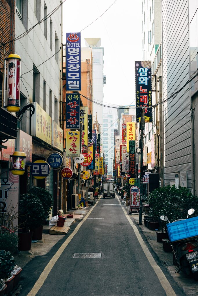Vibrant Urban Street Scene Wallpaper with Colorful Hieroglyph Signs