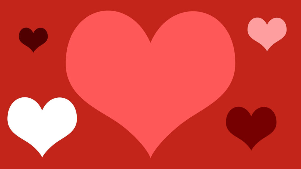 Vibrant Valentine's Day Wallpaper with Colorful Hearts on Red Background