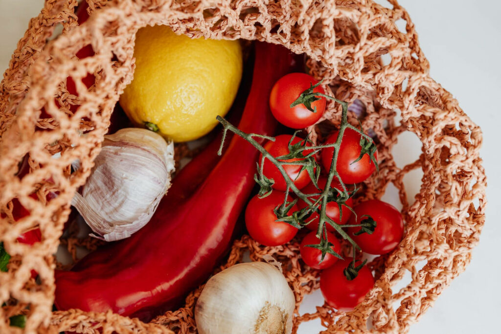 Eco-Friendly Vegetable Wallpaper: Fresh Produce in a Mesh Bag