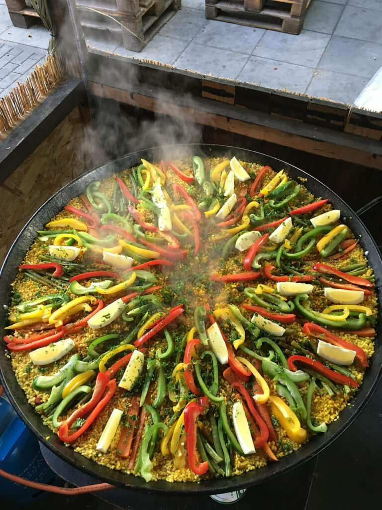 Vibrant Vegetable Paella Wallpaper: Colorful Bell Peppers Delight