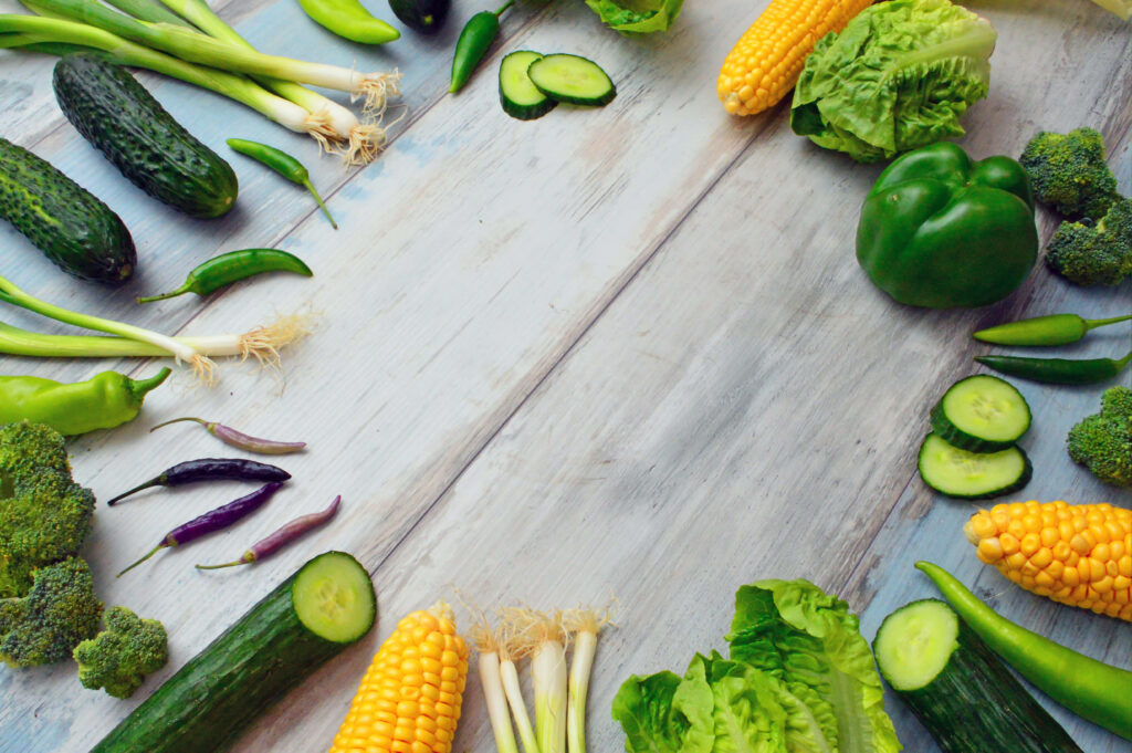Vibrant Vegetable Wallpaper: Fresh Greens on Rustic Wood Background