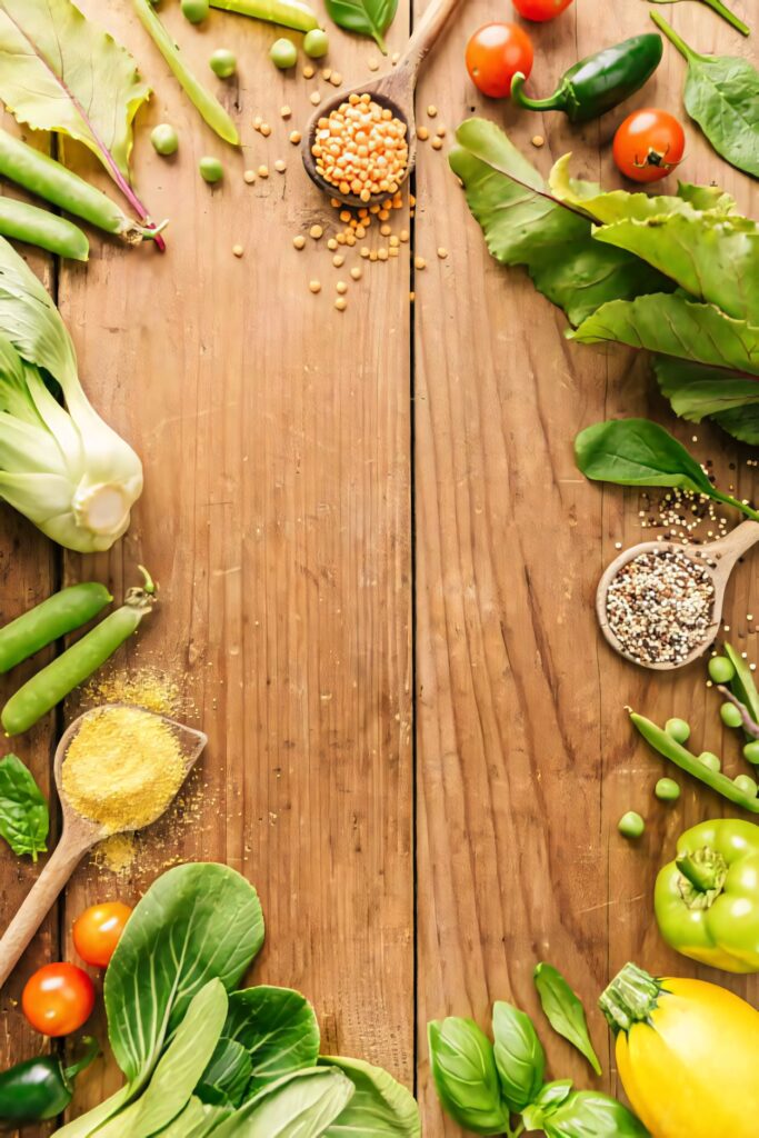 Vibrant Wallpaper of Leafy Vegetables & Colorful Produce on Wood