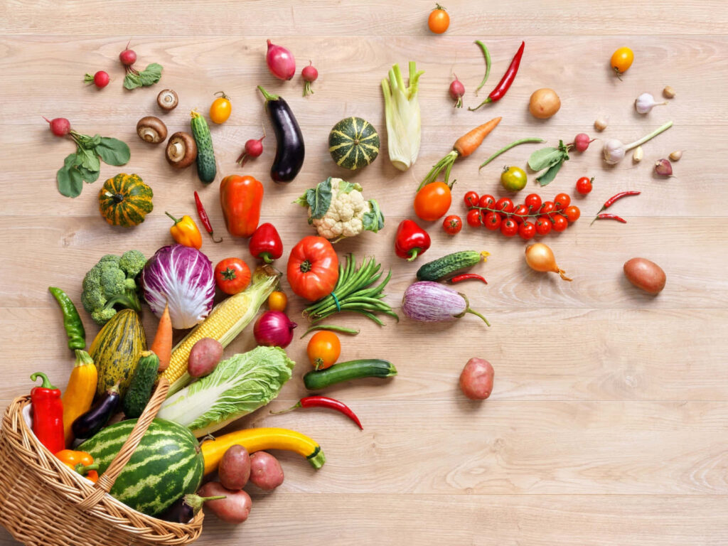 Vibrant Vegetable & Fruit Wallpaper: Fresh Produce on Wooden Surface