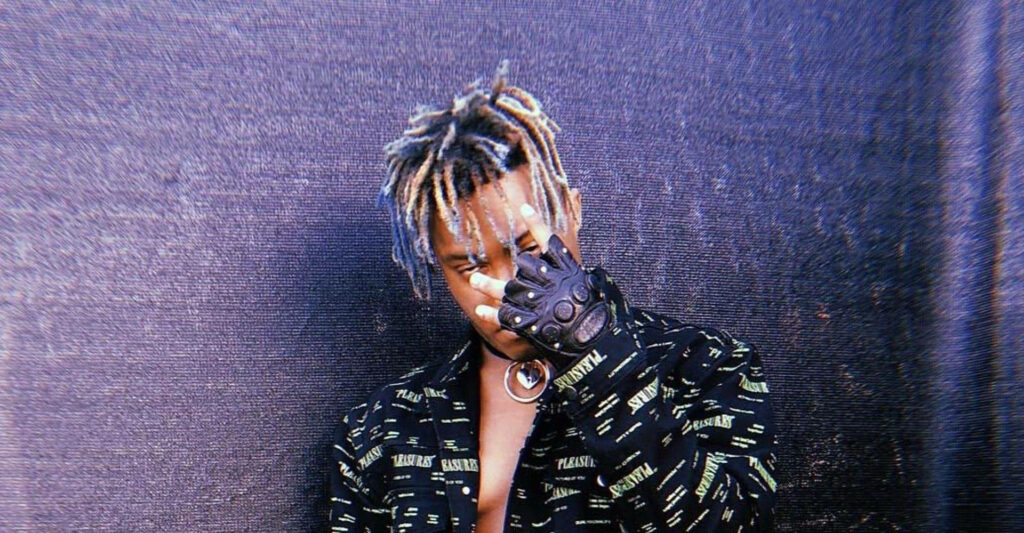 Gloved Up with Juice Wrld: A Vibrant Desktop Background to Keep You Inspired Wallpaper