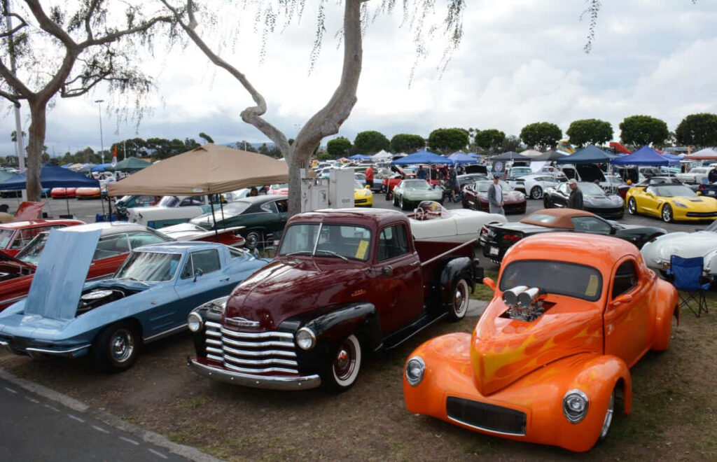 Vibrant Vintage Car Show: Classic Hot Rods & Chevy Trucks Wallpaper