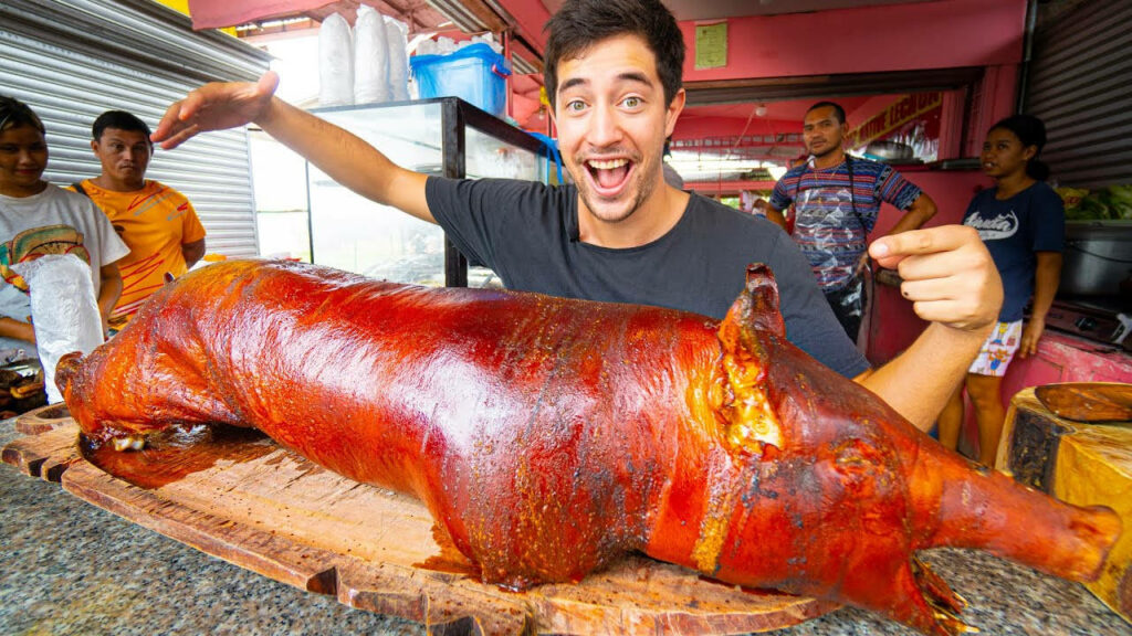 Vibrant Lechon Vlog: Golden Crispy Skin in Market Wallpaper