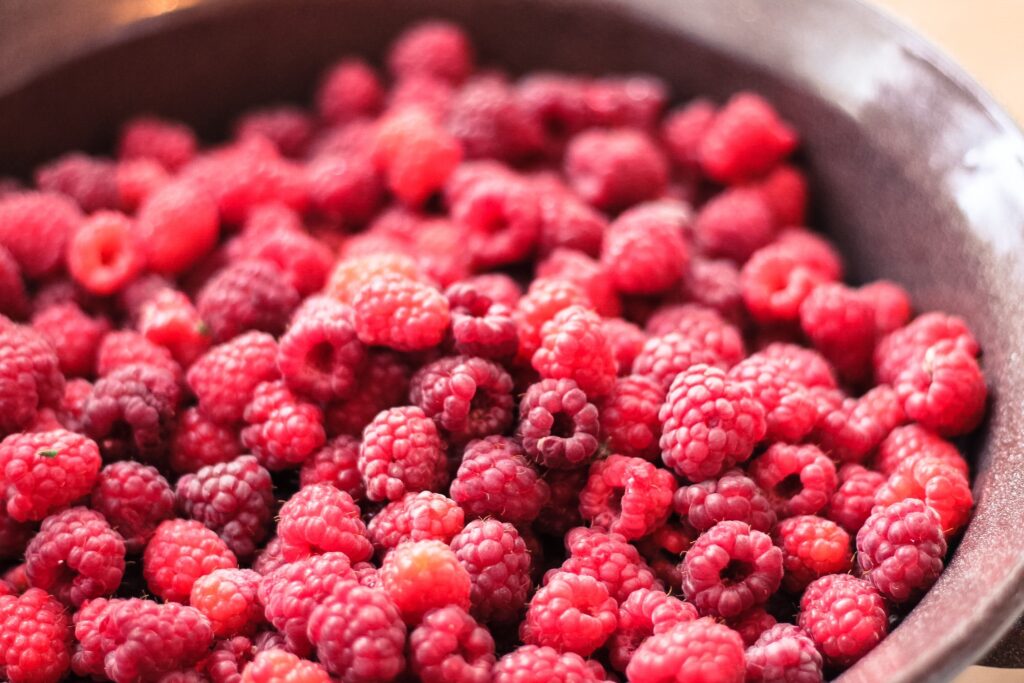 Vibrant Raspberry Bowl Wallpaper Background for Your Space