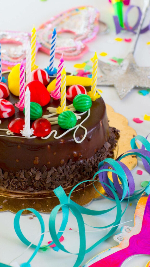 Festive Chocolate Birthday Cake Wallpaper with Colorful Decor