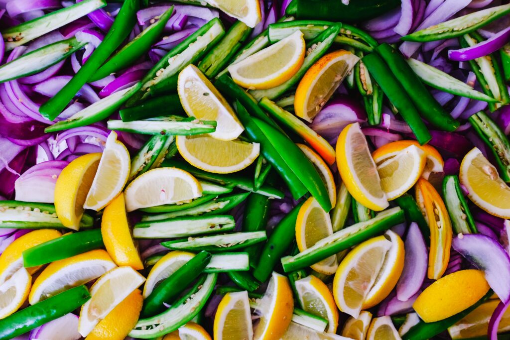 Vibrant Wallpaper: Colorful Lemon Slices, Peppers & Onions