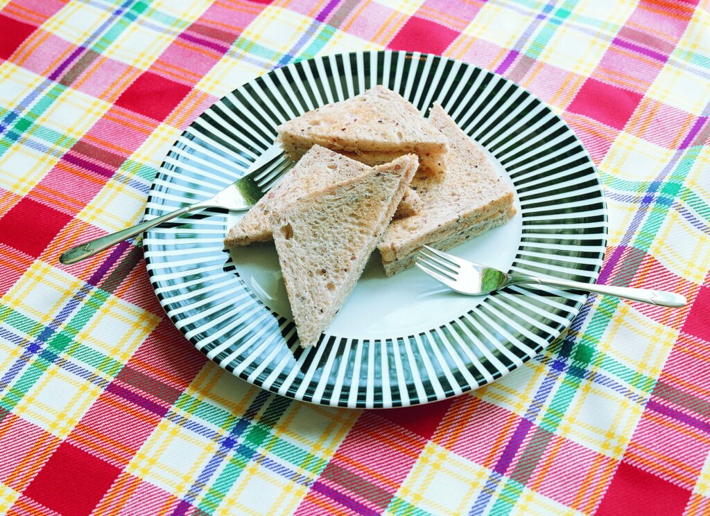 Vibrant Wallpaper: Colorful Plate of Triangular Bread Slices & Forks