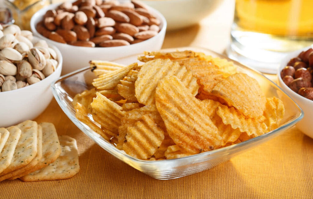Delicious Potato Ridge Chips & Nuts Wallpaper Background