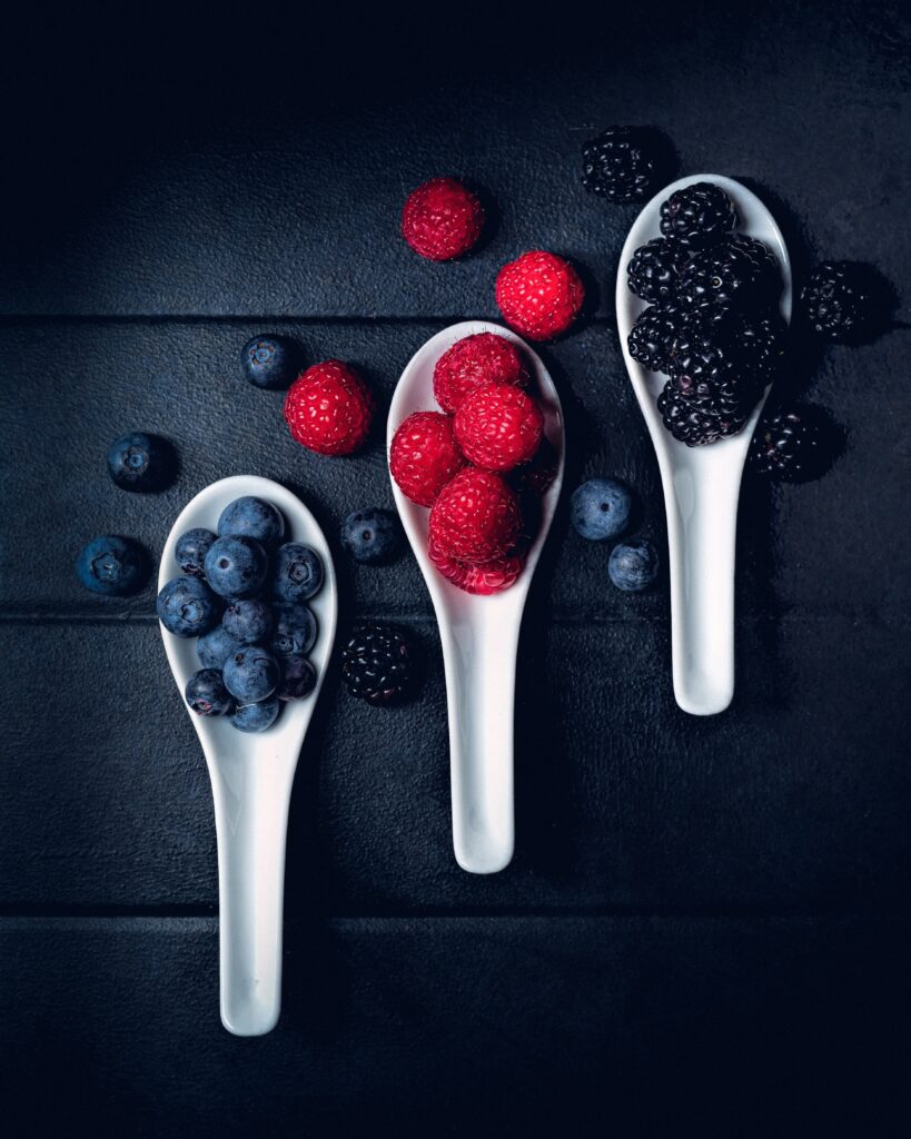 Vibrant Berry Wallpaper: Blueberries, Raspberries & Blackberries in Spoons