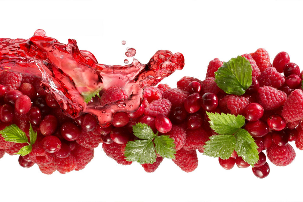 Vibrant Wallpaper: Fresh Cranberries & Raspberries Splash Background
