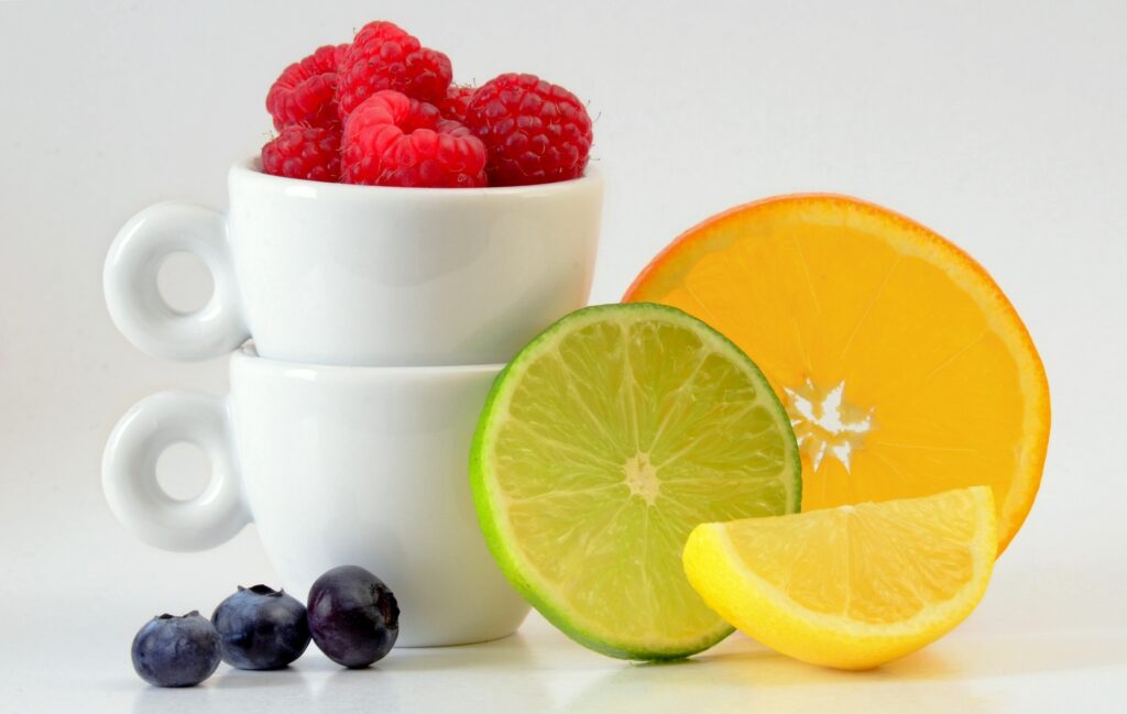 Vibrant Fruit Wallpaper: Raspberries, Blueberries & Citrus Burst