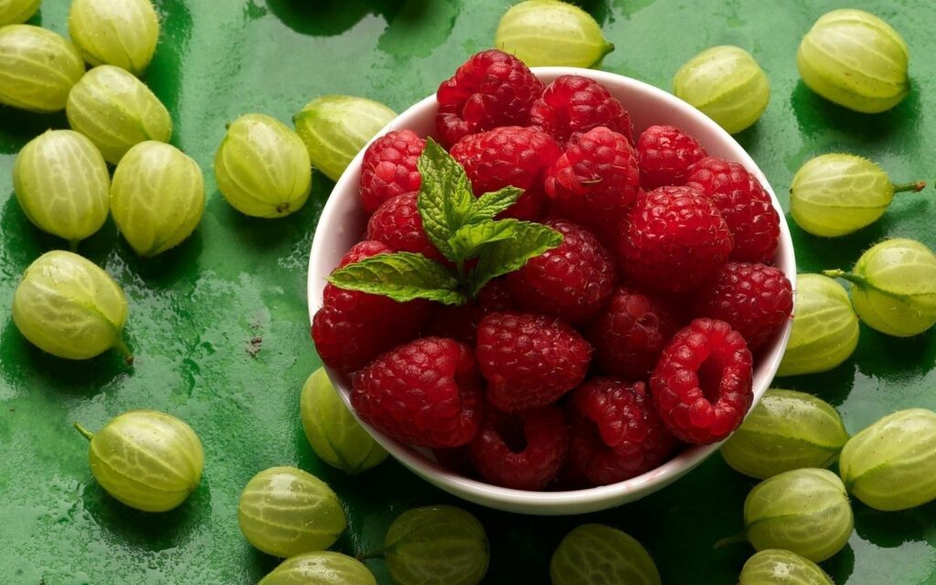 Vibrant Raspberry and Gooseberry Wallpaper with Mint Leaves