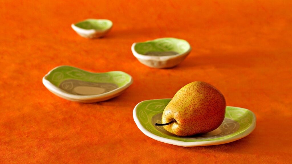 Vibrant Wallpaper: Pear on Green Plate with Orange Background