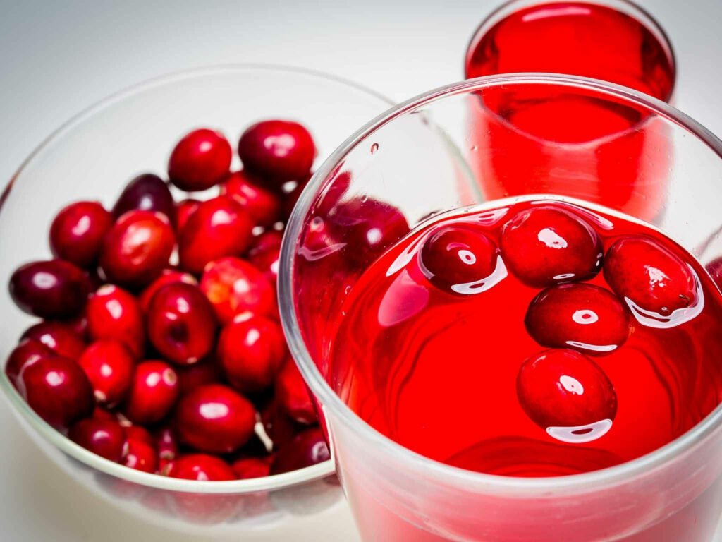 Vibrant Cranberry Juice Wallpaper: Refreshing Red Background Design
