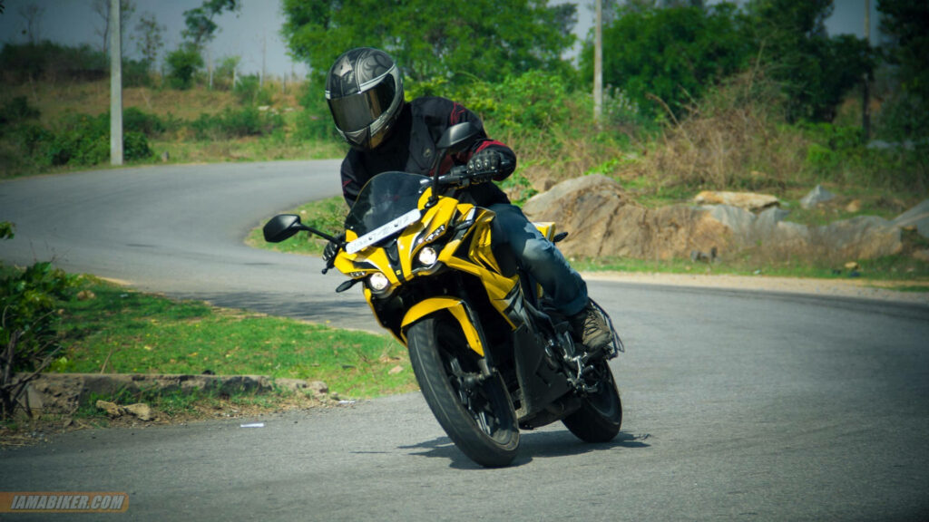 Stunning Rider on Yellow Bajaj Pulsar RS200: Dynamic Wallpaper Background