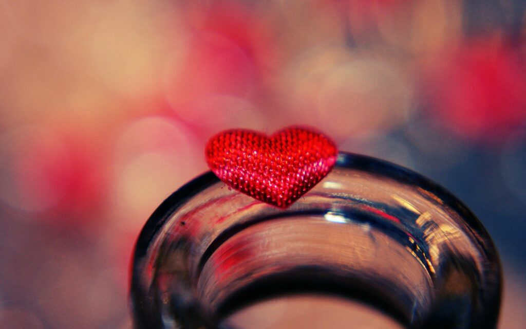 Vibrant Wallpaper: Red Heart on Glass with Colorful Bokeh Light