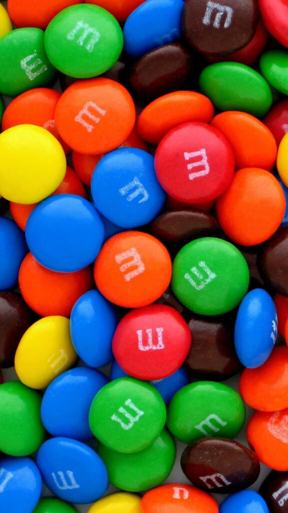 Vibrant M&M's Chocolate Wallpaper - Colorful & Playful Treat Background