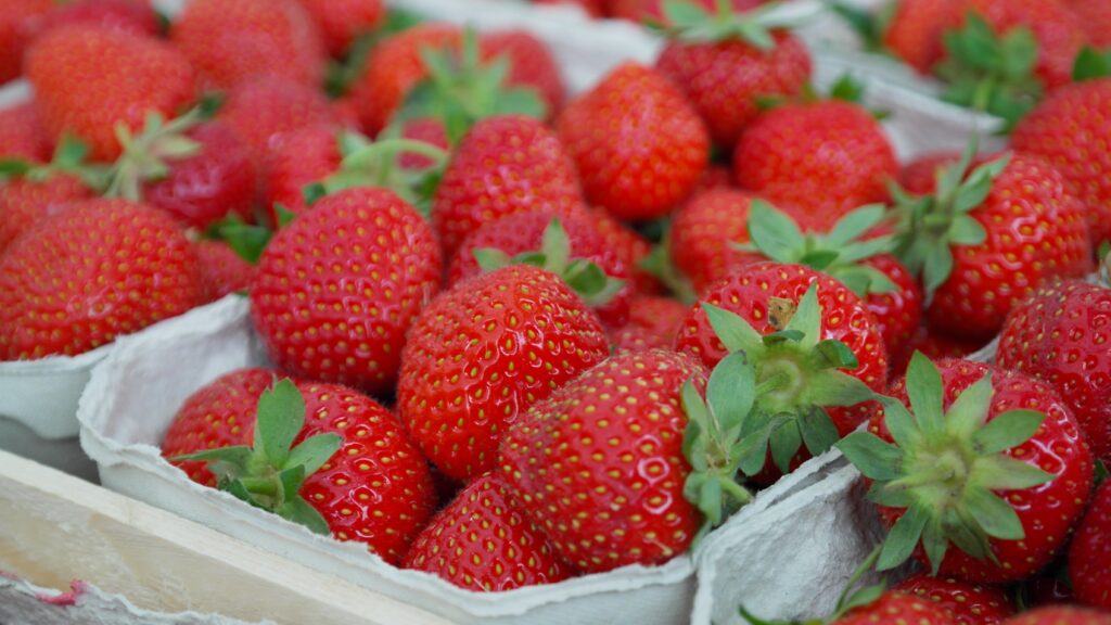 Fresh Ripe Strawberries Wallpaper: Vibrant Red & Green Background