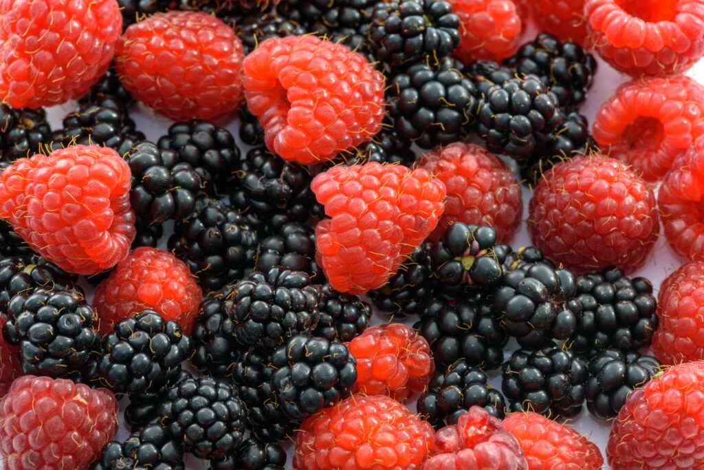Vibrant Wallpaper of Juicy Raspberries and Blackberries Background