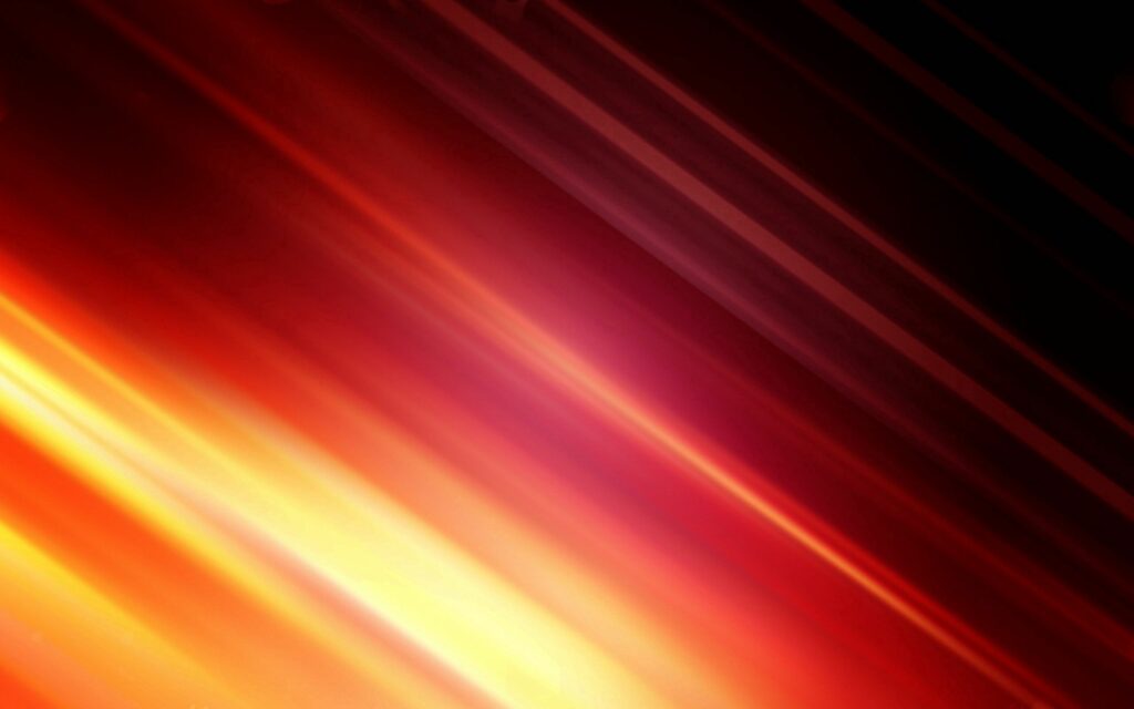 Vibrant Wallpaper of Dynamic Light Streaks in Warm Color Hues