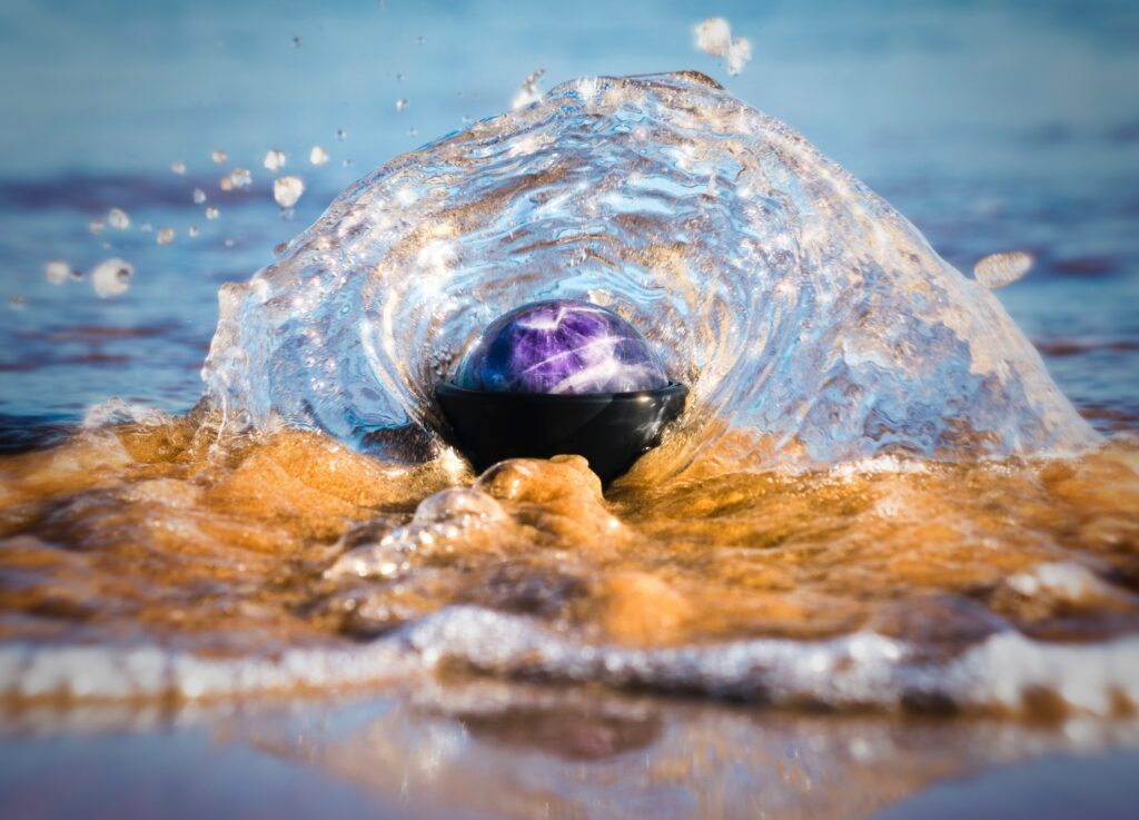 Vibrant Water Splash Wallpaper: Reflective Sphere on Shore