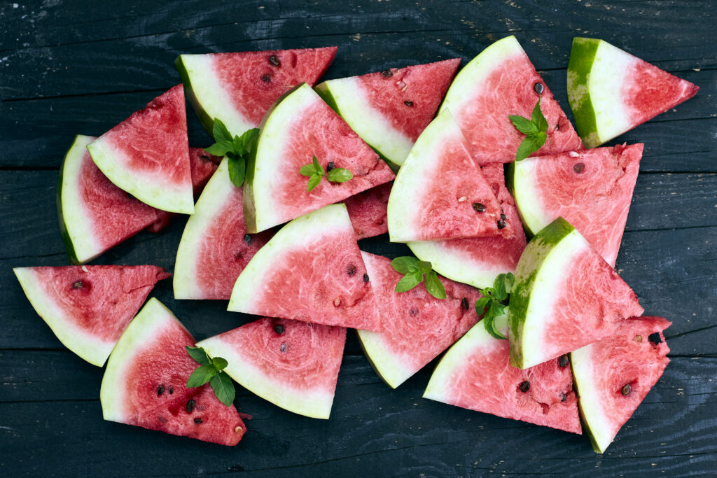 Vibrant Watermelon Wallpaper with Mint on Dark Textured Background