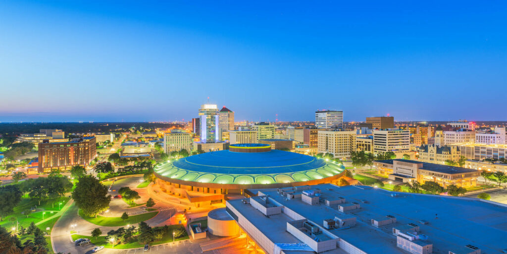 Vibrant Wichita Cityscape at Night - Modern Architecture Wallpaper