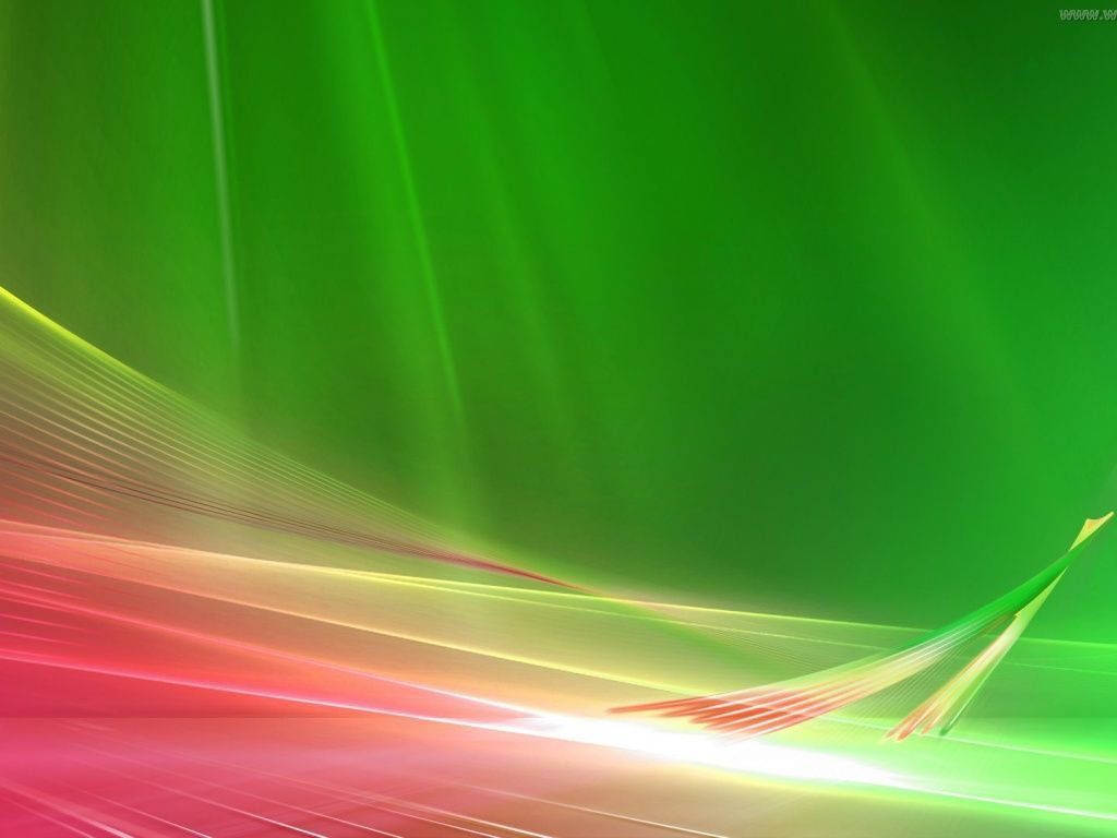 Vibrant abstract wallpaper with flowing pink and green ribbons inspired by classic Windows Vista design