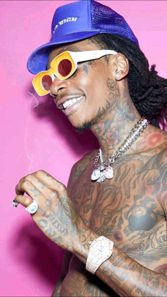 Wiz Khalifa Vibrant Wallpaper: Tattoos & Style on Pink Background