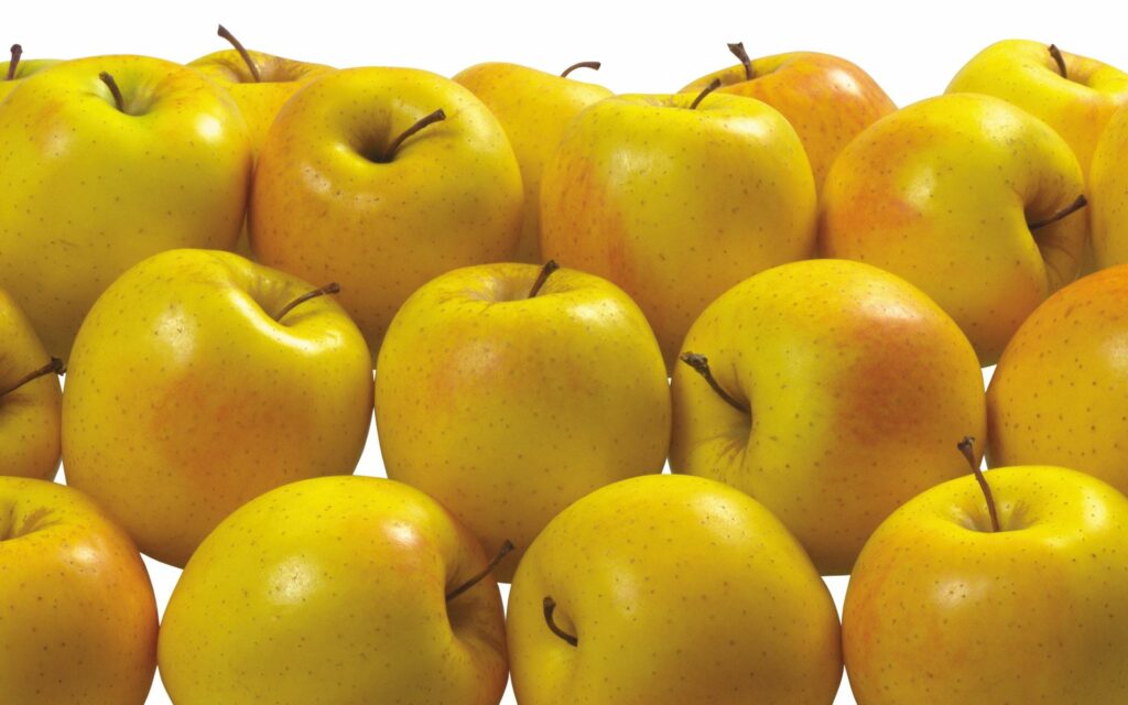 Vibrant Yellow Apple Wallpaper - Fresh & Healthy Background