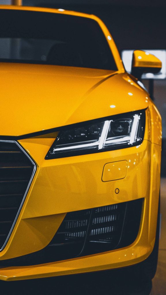 Yellow Audi TT sports car front with sharp LED headlights HD wallpaper background