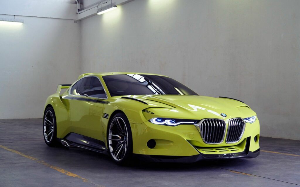 Vibrant Yellow BMW CSL Hommage: Sleek Side View in Minimalist Setting Wallpaper