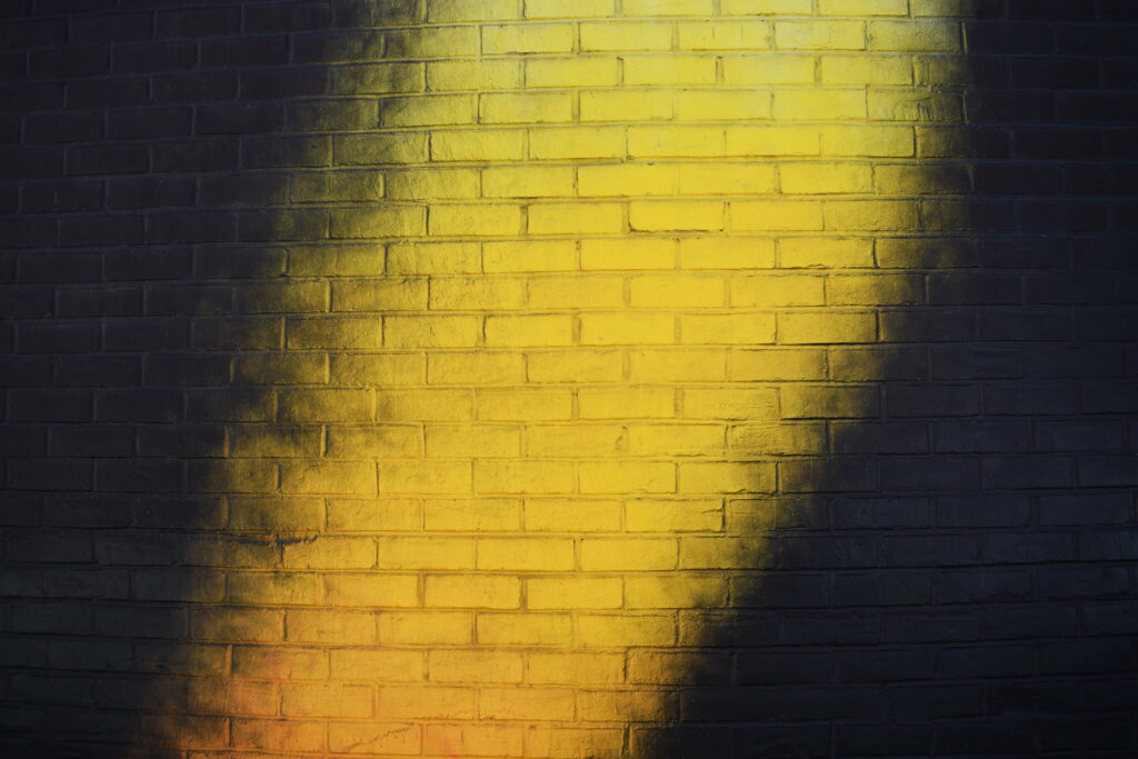 Vibrant Textured Brick Wall - High-Resolution Yellow 5K Wallpaper