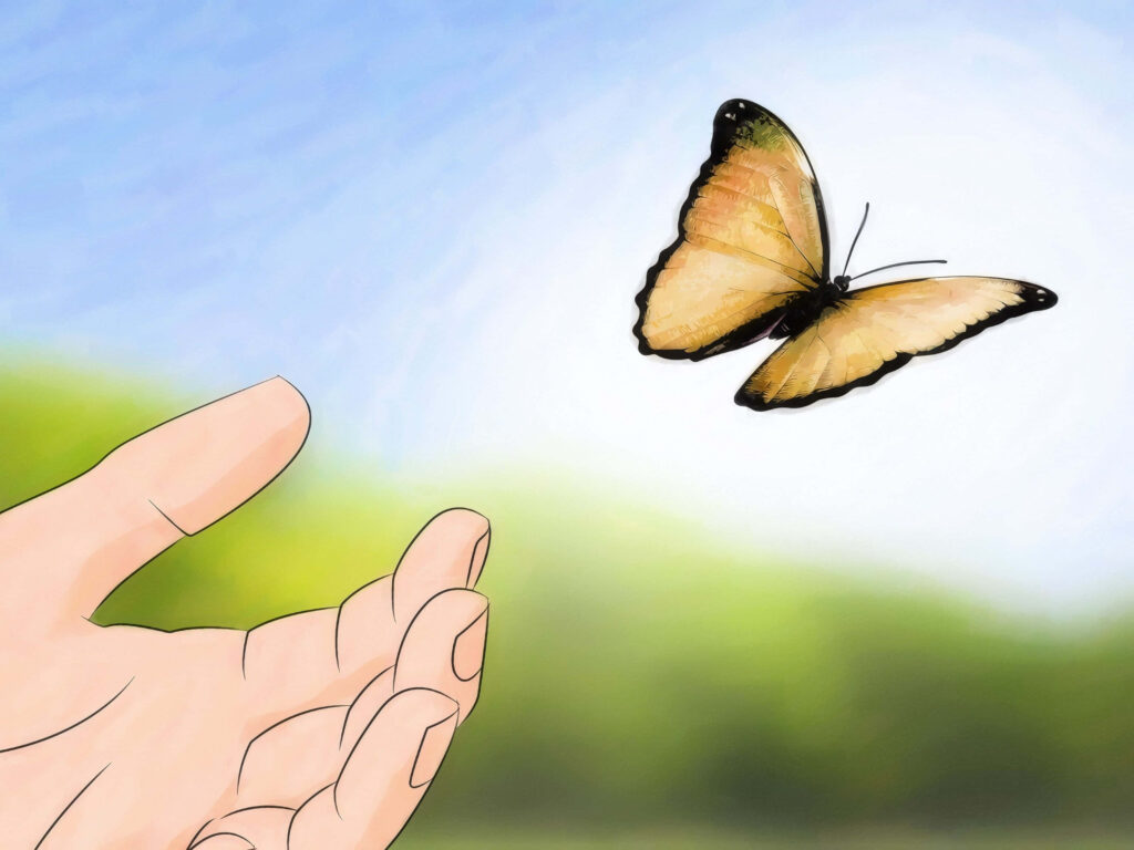 Vibrant Yellow Butterfly Flying from Hand - Serene Wallpaper Background