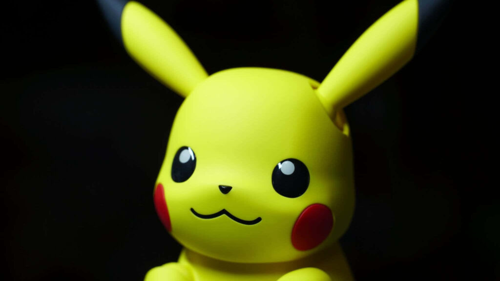 Vibrant Close-Up Wallpaper of Iconic Yellow Character on Dark Background