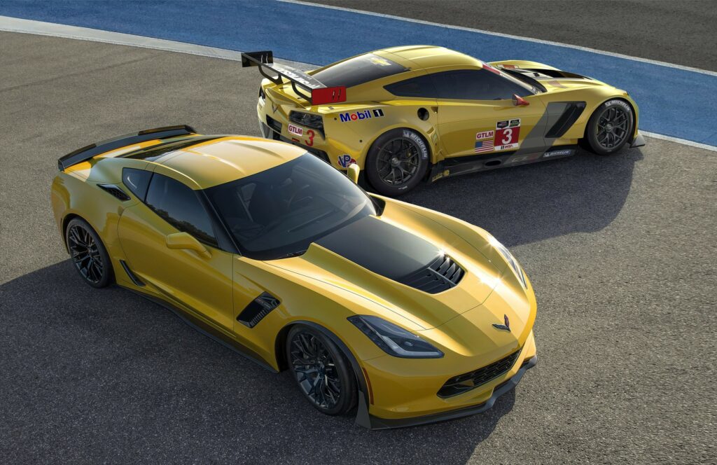 Vivid Yellow Chevrolet Z06: Luxury Sports Cars on Racetrack Wallpaper